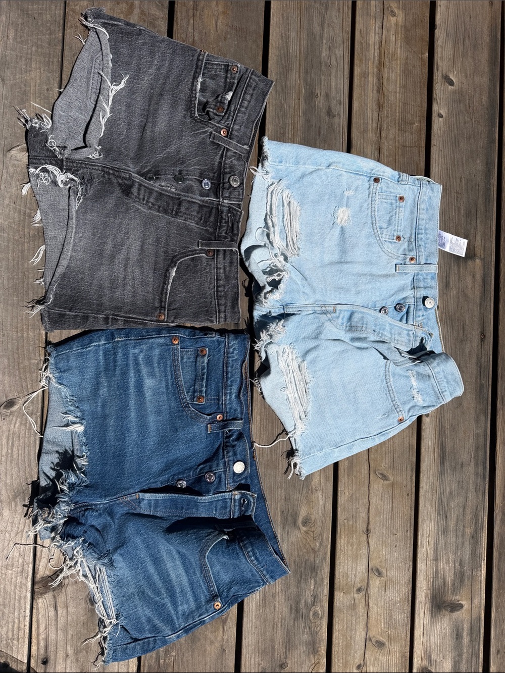 Levi's Trio of Cutoff Denim Shorts in Black, Light Blue & Mid Blue - Picture 2 of 5